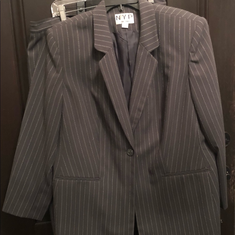 Darker gray pin striped skirt and blazer ensemble.